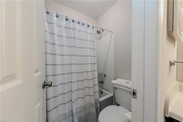 bathroom with toilet and shower / bath combination with curtain
