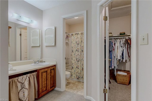 bathroom with vanity, toilet, a textured ceiling, a spacious closet, and shower / tub combo