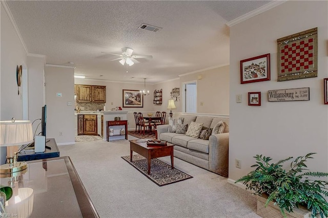 living room featuring crown molding, visible vents, light colored carpet, a textured ceiling, and ceiling fan with notable chandelier