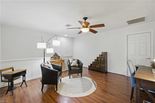 home office with visible vents, ceiling fan, and wood finished floors