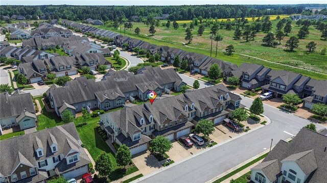 birds eye view of property with a residential view
