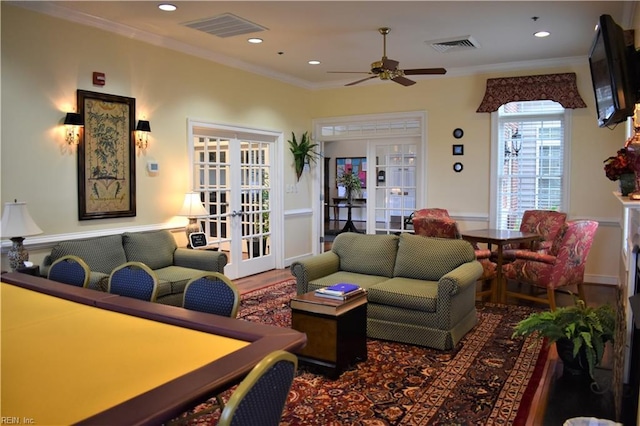 living room with a ceiling fan, french doors, visible vents, crown molding, and recessed lighting