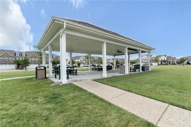 view of home's community featuring a lawn and a residential view