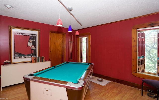recreation room with baseboards, pool table, a textured ceiling, and wood finished floors