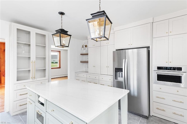 kitchen featuring open shelves, light tile patterned flooring, baseboard heating, light countertops, and stainless steel appliances