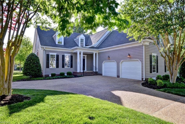 cape cod house featuring a garage, a front lawn, roof with shingles, and concrete driveway