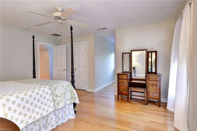 bedroom with baseboards, visible vents, and light wood-type flooring
