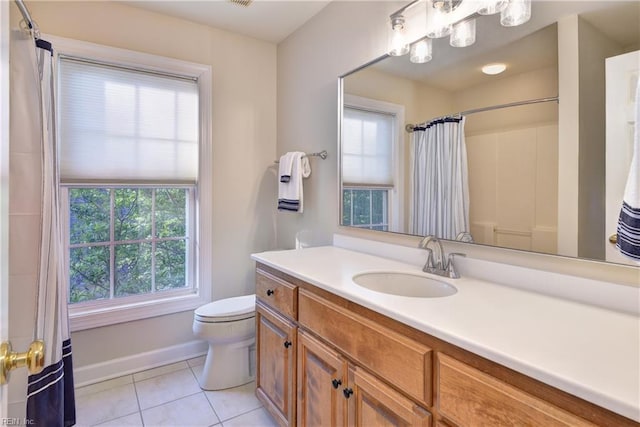 bathroom featuring vanity, toilet, tile patterned floors, baseboards, and curtained shower