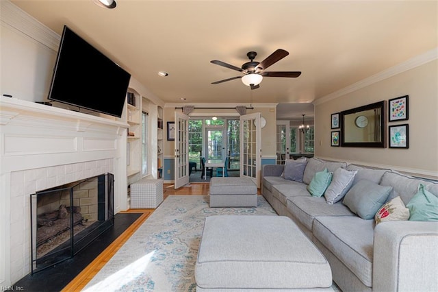 1130 Crystalwood Cir, Chesapeake, VA 23320 - living room with ornamental molding, a ceiling fan, wood finished floors, recessed lighting, and a fireplace with flush hearth