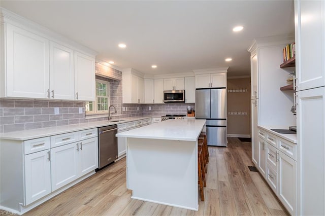 1130 Crystalwood Cir, Chesapeake, VA 23320 - kitchen with decorative backsplash, open shelves, a sink, stainless steel appliances, and white cabinetry
