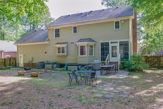 1130 Crystalwood Cir, Chesapeake, VA 23320 - back of property with a fenced backyard, a patio area, central AC, and a chimney