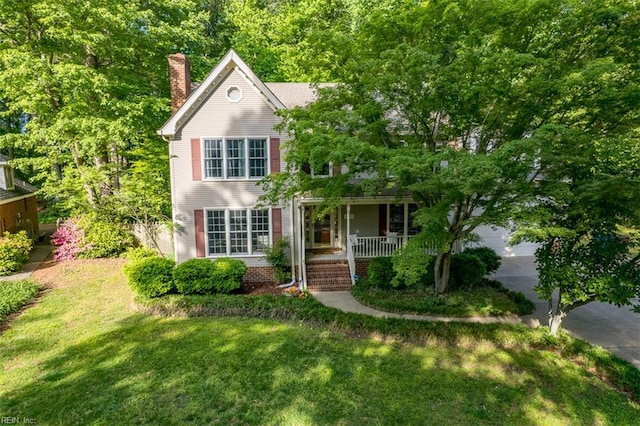 1130 Crystalwood Cir, Chesapeake, VA 23320 - view of front of property with a chimney, a porch, and a front lawn