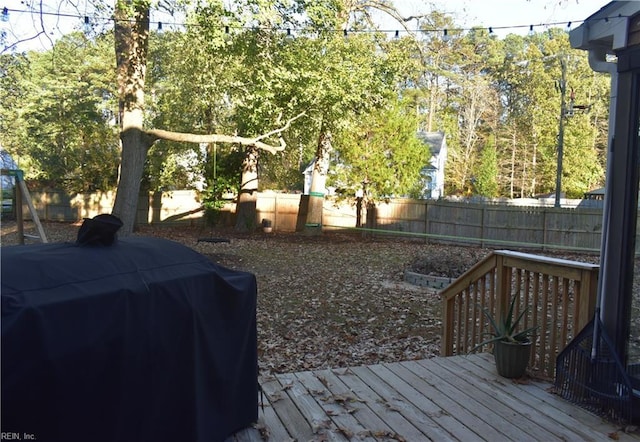 exterior space with a fenced backyard and a deck