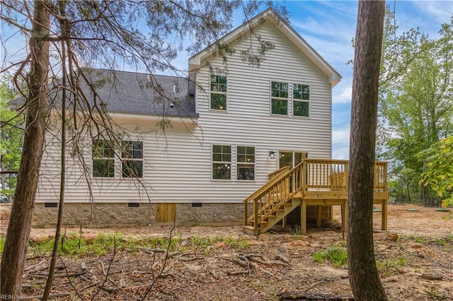 back of property featuring a wooden deck, stairs, roof with shingles, and crawl space