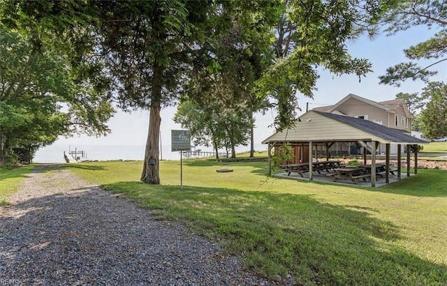 surrounding community with a yard, a gazebo, and a patio area