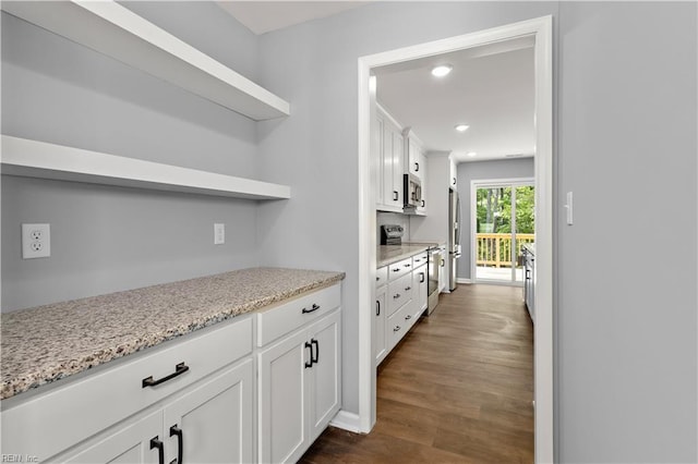 bar featuring recessed lighting, stainless steel appliances, and dark wood finished floors