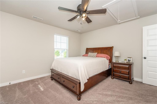 bedroom featuring visible vents, attic access, baseboards, and light colored carpet