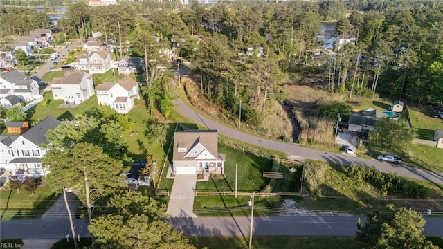 birds eye view of property with a residential view