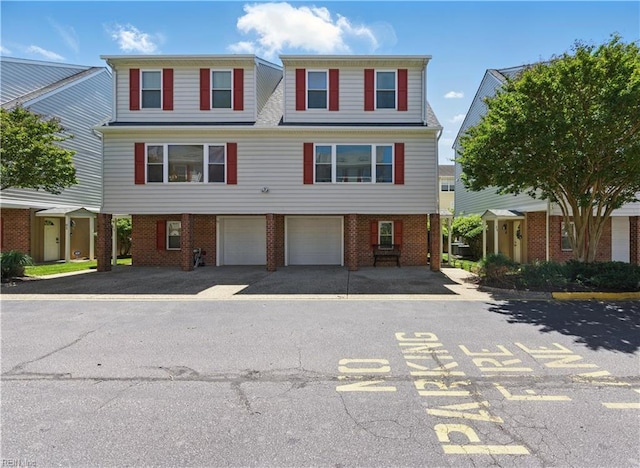 8550 Tidewater Dr Unit I2, Norfolk, VA 23503 - multi unit property with a garage, driveway, and brick siding