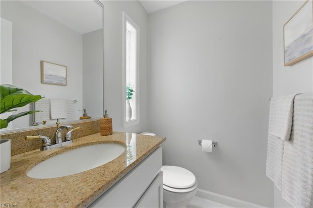8550 Tidewater Dr Unit I2, Norfolk, VA 23503 - bathroom with toilet, baseboards, plenty of natural light, and vanity