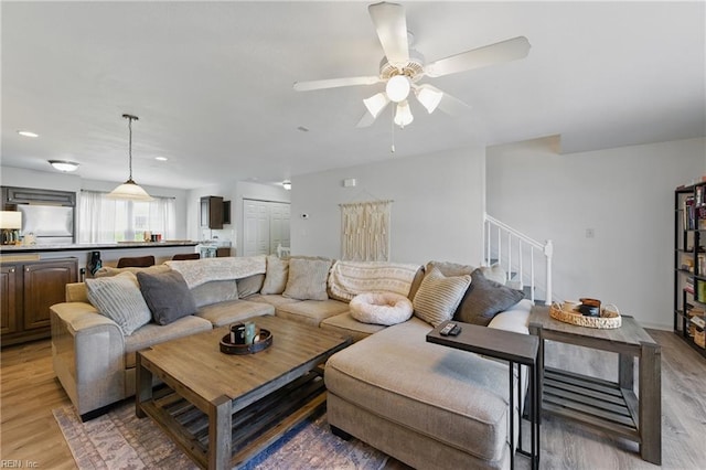 8550 Tidewater Dr Unit I2, Norfolk, VA 23503 - living area with light wood-type flooring, a ceiling fan, stairs, and recessed lighting