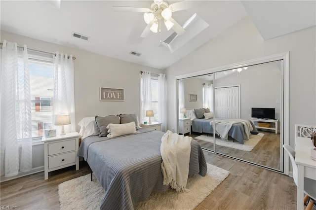 8550 Tidewater Dr Unit I2, Norfolk, VA 23503 - bedroom with visible vents, lofted ceiling, wood finished floors, and a closet