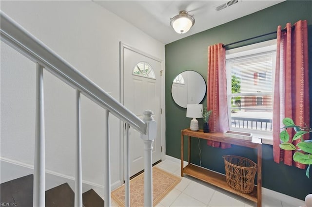 8550 Tidewater Dr Unit I2, Norfolk, VA 23503 - tiled foyer with baseboards, stairs, and visible vents