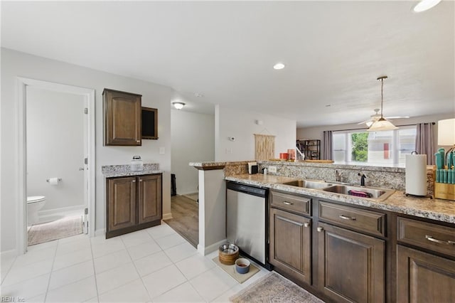 8550 Tidewater Dr Unit I2, Norfolk, VA 23503 - kitchen with dishwashing machine, baseboards, light stone countertops, and a sink