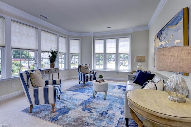 carpeted living room with a healthy amount of sunlight, baseboards, crown molding, and visible vents