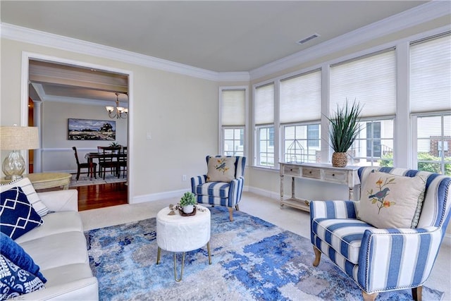 carpeted living area featuring an inviting chandelier, baseboards, crown molding, and plenty of natural light