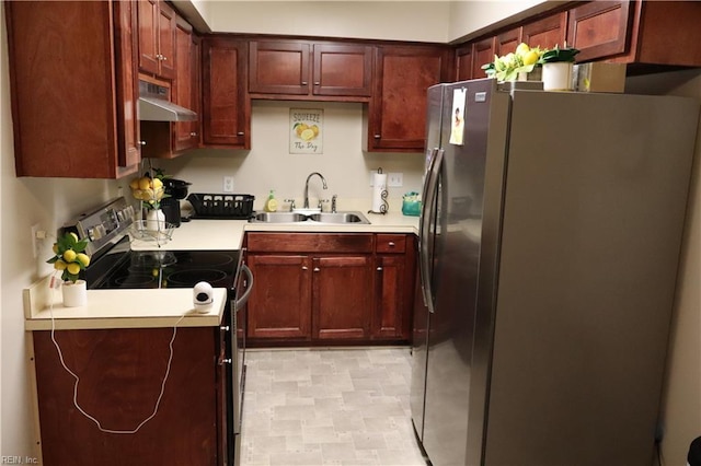 kitchen with range with electric stovetop, freestanding refrigerator, a sink, ventilation hood, and light countertops