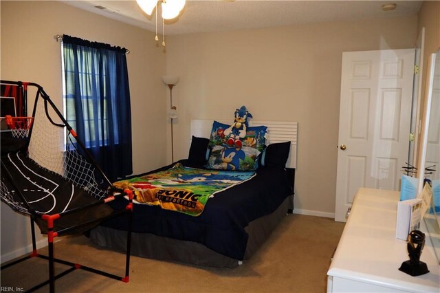 bedroom featuring carpet floors and baseboards