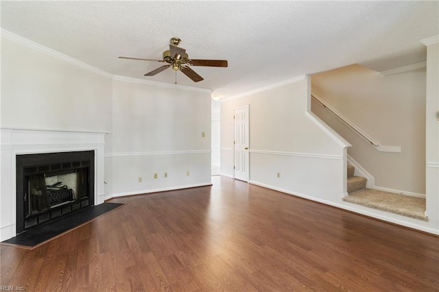 117 Gnarled Oak Ln, Yorktown, VA 23692 - unfurnished living room featuring ceiling fan, wood finished floors, stairway, a fireplace with raised hearth, and ornamental molding