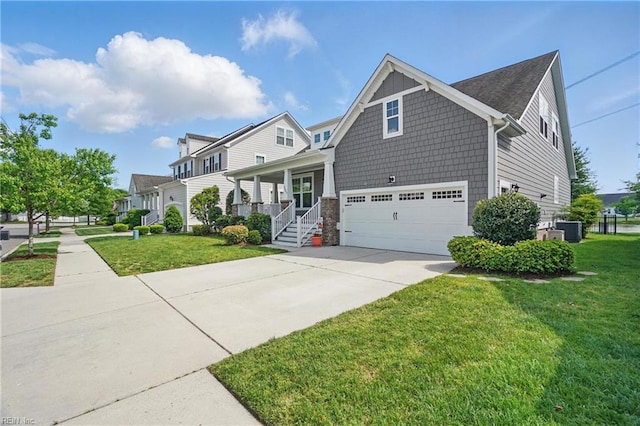 view of front of home with concrete driveway, central AC unit, a front lawn, and a garage