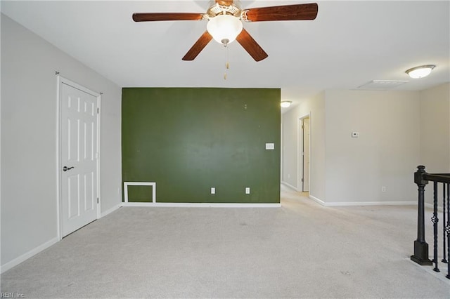 unfurnished room with baseboards, carpet flooring, and ceiling fan