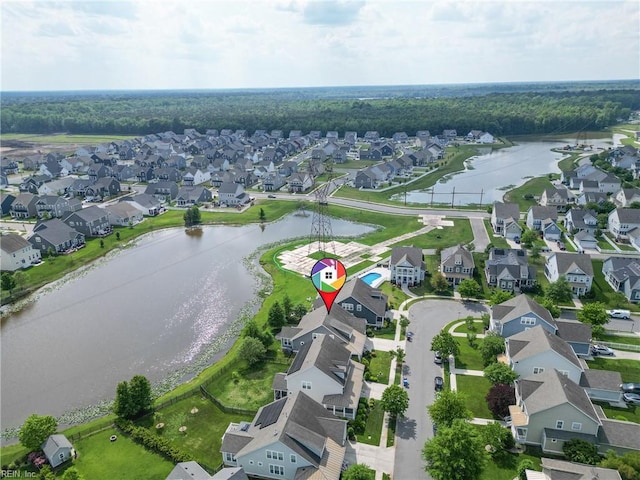 drone / aerial view with a water view and a residential view
