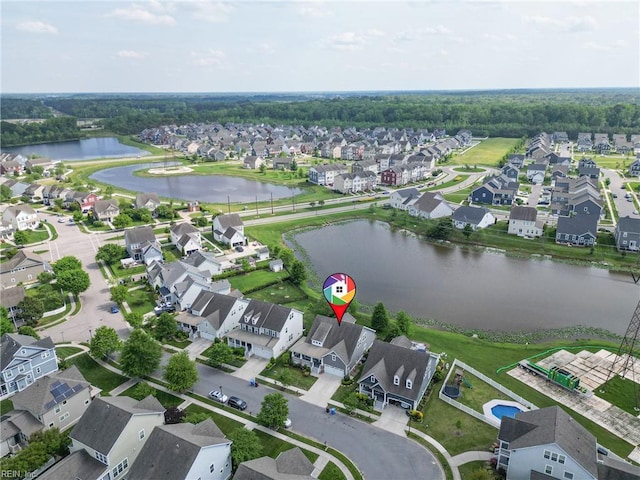 drone / aerial view featuring a water view and a residential view