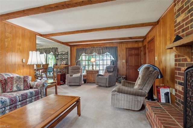 living area with carpet, a brick fireplace, beam ceiling, and wooden walls