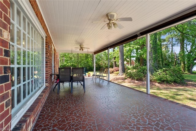 view of patio with a ceiling fan and outdoor dining area