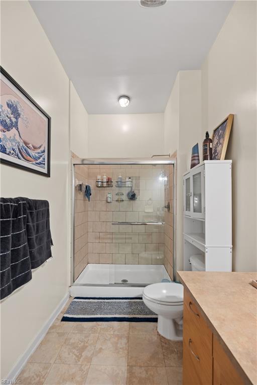 1400 Granby St Unit 117, Norfolk, VA 23510 - full bathroom with vanity, toilet, baseboards, and a stall shower