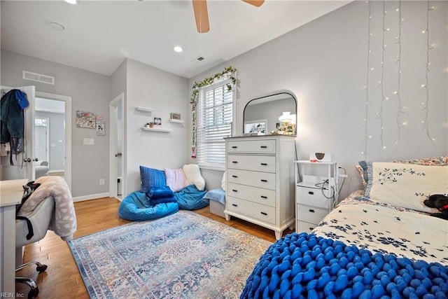 bedroom featuring ceiling fan, recessed lighting, wood finished floors, and visible vents
