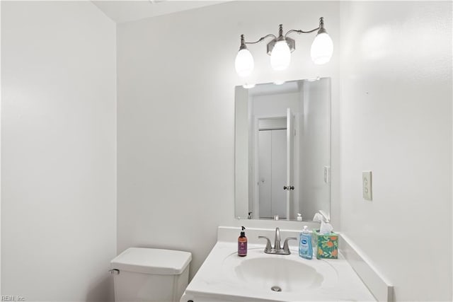 bathroom with toilet and vanity