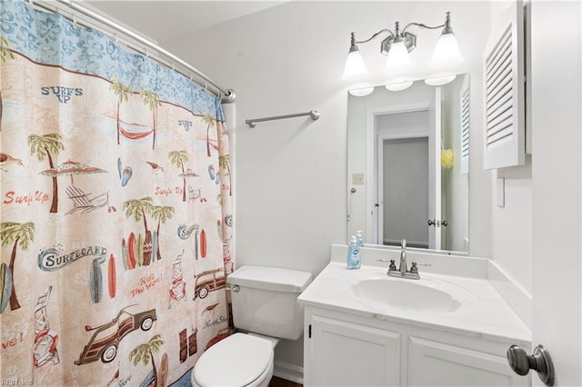 full bathroom featuring vanity, toilet, and curtained shower