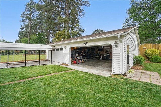 detached garage featuring fence