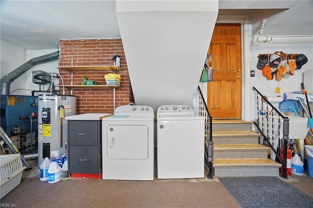 laundry area with water heater, laundry area, and washer and clothes dryer