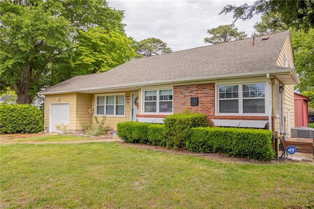 1628 Red Brook Ct, Norfolk, VA 23518 - view of front of home with a front yard, an attached garage, a shingled roof, and brick siding