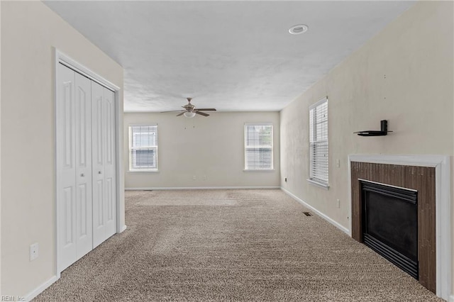 159 Stoney Ridge Ave, Suffolk, VA 23435 - unfurnished living room with carpet floors, ceiling fan, and a glass covered fireplace