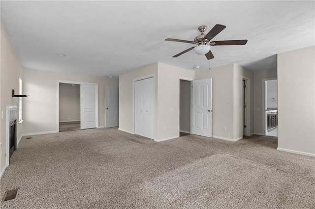 159 Stoney Ridge Ave, Suffolk, VA 23435 - unfurnished living room with carpet floors, a glass covered fireplace, a ceiling fan, baseboards, and visible vents