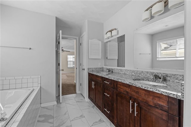 159 Stoney Ridge Ave, Suffolk, VA 23435 - full bathroom featuring a sink, double vanity, marble finish floor, a healthy amount of sunlight, and a garden tub