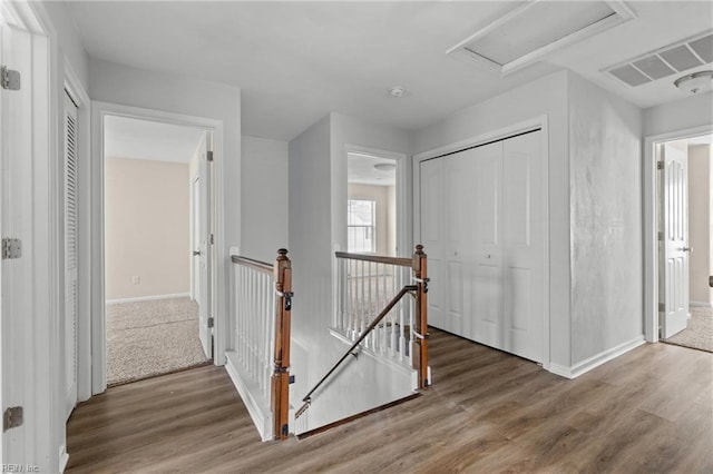 159 Stoney Ridge Ave, Suffolk, VA 23435 - hall with attic access, visible vents, wood finished floors, baseboards, and an upstairs landing